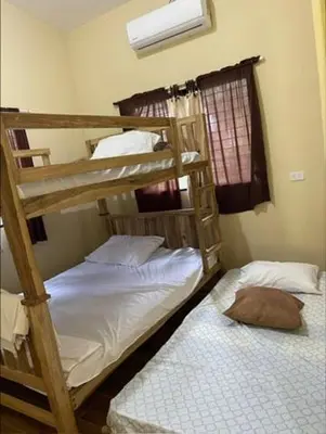 two bunk beds in a small room with at DONDE ANTONIO BARRA DE SANTIAGO in Barra de Santiago
