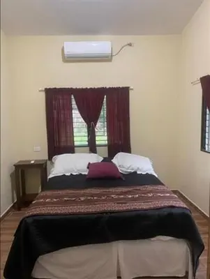a bedroom with a large bed with a window at DONDE ANTONIO BARRA DE SANTIAGO in Barra de Santiago