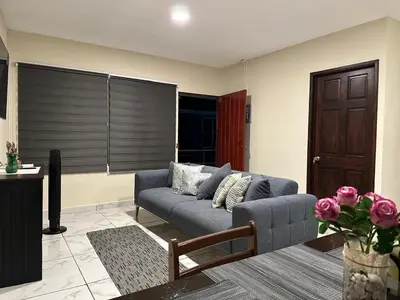 a living room with a couch and a table at Placentero y acogedor apartamento en Calle Monserrat in San Salvador
