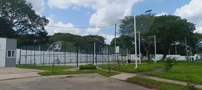 a fence in front of a tennis court at Casa de Reyes in San Miguel