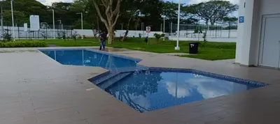 a blue swimming pool in the middle of a building at Casa de Reyes in San Miguel
