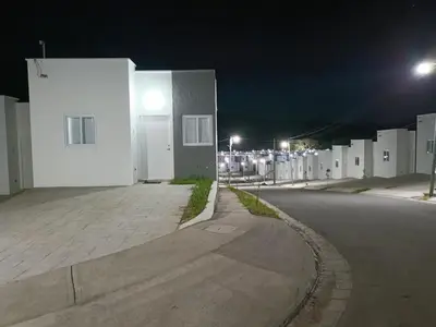 an empty street next to a white building at night at Casa de Reyes in San Miguel