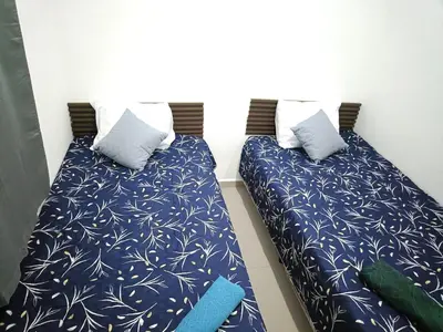 two beds sitting next to each other in a room at Casa de Reyes in San Miguel