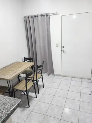 a room with a table and chairs and a door at Holiday home in San Miguel