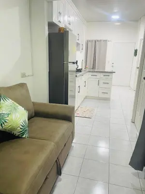 a living room with a couch and a refrigerator at Holiday home in San Miguel