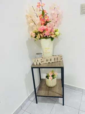 a table with a vase of flowers on it at Holiday home in San Miguel