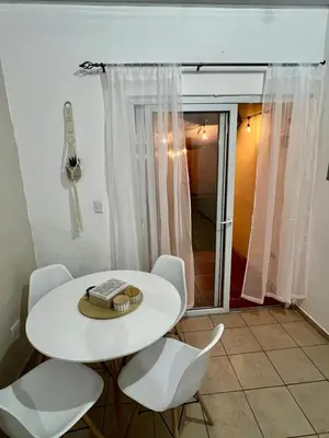 a white table with white chairs and a keyboard on it at Casa Luz - complete with pool access in Sitio del Niño