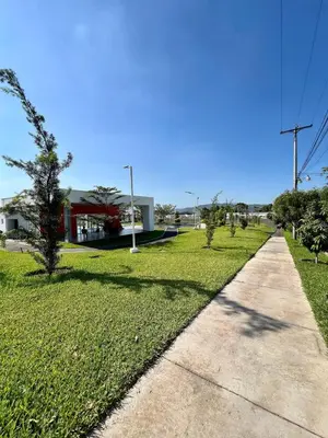 a sidewalk in a park with grass and trees at Casa Luz - complete with pool access in Sitio del Niño