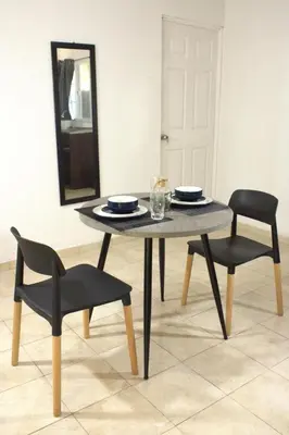 a table with two chairs and a table and a mirror at Eco Villa, El Sunzal ISA Surfing in El Sunzal