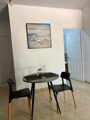 a table and two chairs in a room at Eco Villa, El Sunzal ISA Surfing in El Sunzal