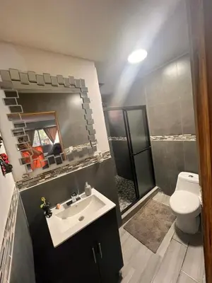 a bathroom with a sink and a toilet at Smart and Modern Room Full Amenities in San Salvador in San Salvador