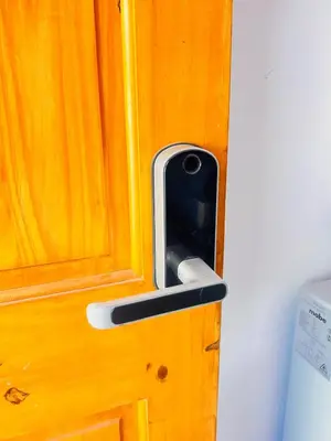 a wooden door with a handle on a wooden door at Smart and Modern Room Full Amenities in San Salvador in San Salvador