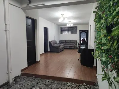 a living room with a couch and a chair at Kartagus Centric in San Salvador