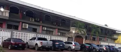 a group of cars parked in front of a building at Pearl of the sea in La Libertad