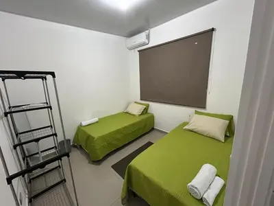a small room with two beds and a ladder at Nueva San Miguel Miami 703 in San Miguel