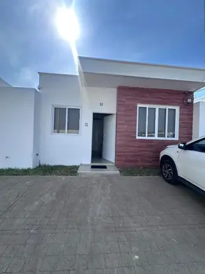 a white car parked in front of a house at Nueva San Miguel Miami 703 in San Miguel