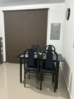 a dining room table with four chairs around it at Nueva San Miguel Miami 703 in San Miguel