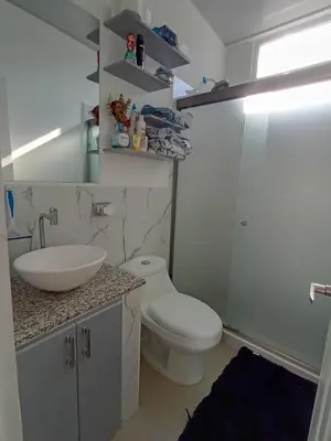 a bathroom with a white toilet and a sink at Residencial Nueva San Miguel Miami 703 in San Miguel