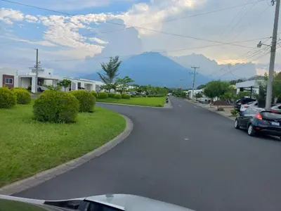 a street with cars parked on the side of the road at Casa Romero in San Miguel