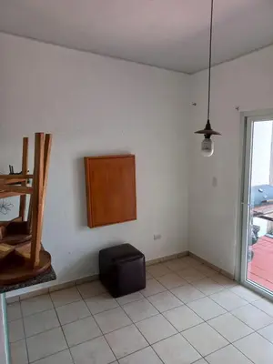 a room with a chair and a table and a window at Casa Romero in San Miguel