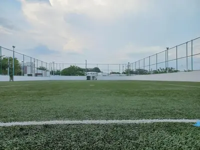 a soccer field with a fence and a soccer ball at Casa Romero in San Miguel