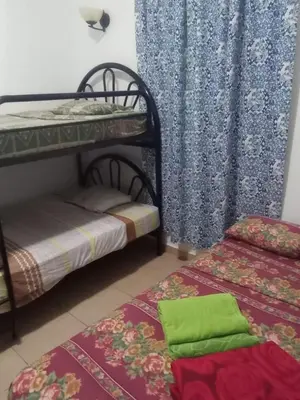 a room with two bunk beds and a curtain at Casa de Playa en residencial las Veraneras San Fer in Los Cóbanos