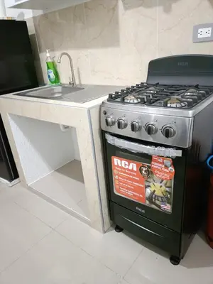 a kitchen with a stove and a sink at Casa de Reyes in San Miguel