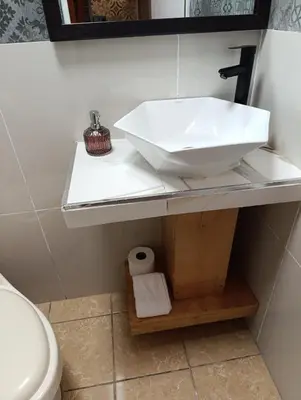 a bathroom with a sink and a toilet at Dinos House in Concepción de Ataco