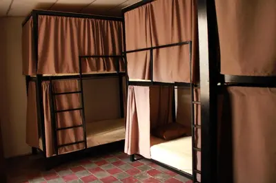 a pair of bunk beds in a room at Hostal Casa Nómada in Santa Ana