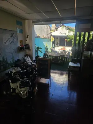 a view of a room with a table and chairs at Casa 25 hostal santa ana in Santa Ana