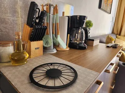 a counter with a wooden counter top with alot of knives at Casa América in San Miguel