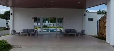 a group of chairs sitting outside of a building at Casa de Reyes in San Miguel