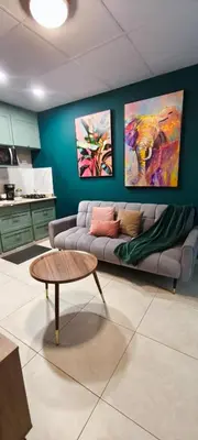 a living room with a couch and a coffee table at La casa de Bába in San Salvador