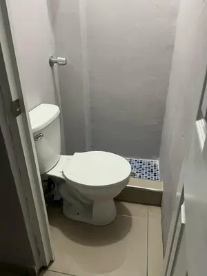a small bathroom with a toilet and a shower at Livo house in San Salvador in San Salvador