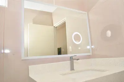 a bathroom with a sink and a mirror at Hotel y Restaurante Santa Fe in La Libertad