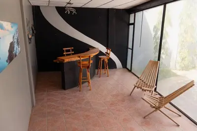 a room with a table and chairs in a room at Casa Familiar con Piscina y Aire Acondicionado Concepción Batres in Concepción Batres