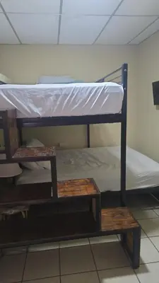 a couple of bunk beds in a room at casa de elena in Santa Ana
