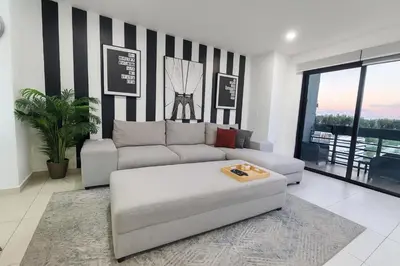 a living room with a couch and a table at Silvertop - A magical apartment with great view in San Salvador