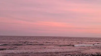 a view of the ocean at sunset at Litos Hotel in La Libertad