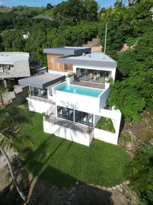 an aerial view of a house with a swimming pool at St Michaels Ocean View House in El Zonte