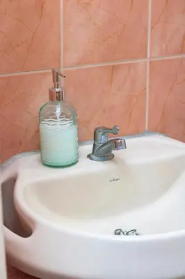 a soap bottle sitting on top of a bathroom sink at Modern Stylish Apt in Secure Area in San Salvador in San Salvador