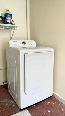 a white washer and dryer sitting next to a wall at Modern Stylish Apt in Secure Area in San Salvador in San Salvador