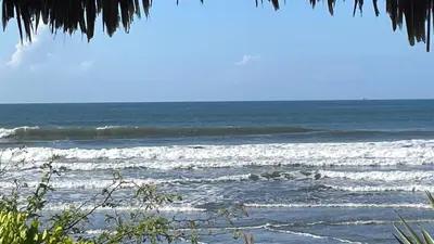 a view of the ocean from a beach with waves at Lodge Ayla Punta Mango in Jucuarán