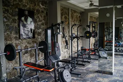 a row of exercise bikes in a gym at Open space concept that allows for multiple places to hang out in San Salvador