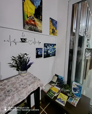 a dining room with a table and a chart on the wall at Susana's house, your home in Ahuachapán in Ahuachapán