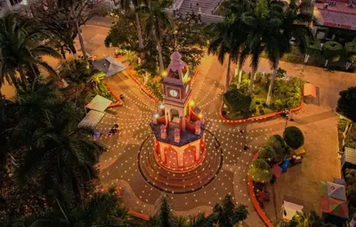 an amusement park with a clock tower in the street at Susana's house, your home in Ahuachapán in Ahuachapán