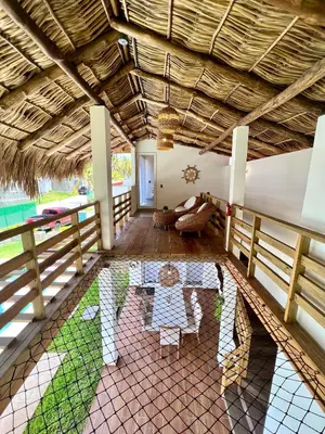 an open living room with a table and chairs at Villa Nakär - Oceanfront Luxury Villa in Playa Amatecampo, El Salvador in La Esmeralda