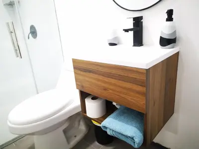 a bathroom with a white sink and a toilet at Apartamento privado, Miramonte, San Salvador in San Salvador