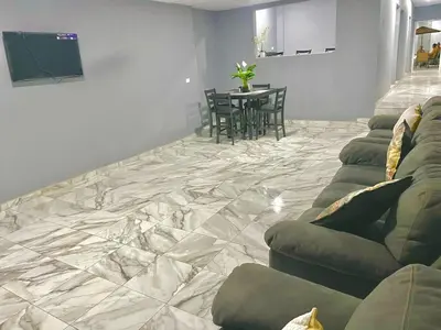 a living room with a couch and a table at Palo Coco Home in Santa Ana