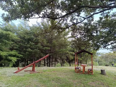 a park with a swing set and a playground at Cabaña Vista Pinares San Ignacio Chalatenango in Chalatenango